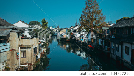 Serene canals lined with weathered homes overflowing with greenery and charm. Zhujiajiao, Shanghai, China 134827293