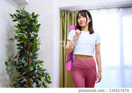 Japanese woman in yoga wear heading to training gym, yoga studio, yoga mat, leggings, trimmed up Japanese woman in yoga wear heading to training gym, yoga studio, yoga mat, leggings, trimmed up 134827879