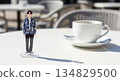 A scene of people enjoying male idol acrylic stands at a cafe. Large copy space on the right. 134829500