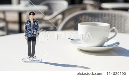 A scene of people enjoying male idol acrylic stands at a cafe. Large copy space on the right. 134829500