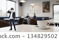 A scene of people enjoying acrylic stands of male characters at a cafe. Large copy space on the right. 134829502