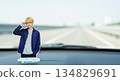 Acrylic stands of male idols displayed on the dashboard of a car. Driving with your favorite idol. Ample copy space. 134829691
