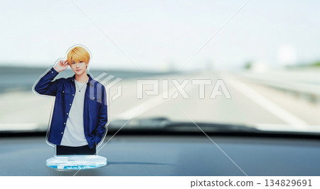 Acrylic stands of male idols displayed on the dashboard of a car. Driving with your favorite idol. Ample copy space. 134829691