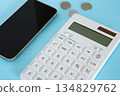 Smartphone, calculator and coins 134829762