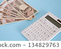 Calculator and money 134829763