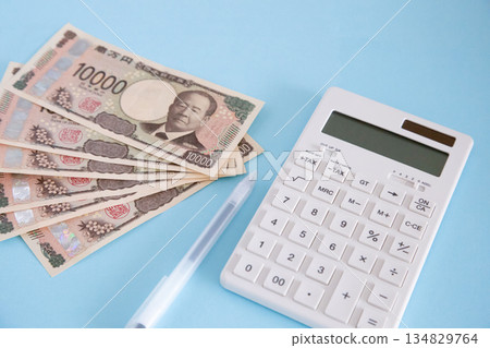 Calculator, money and pen Calculator, money and pen 134829764