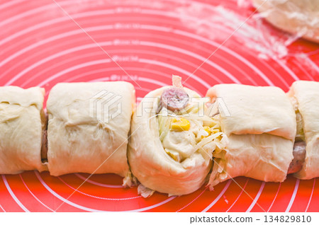 Making herb wiener cheese bread 134829810