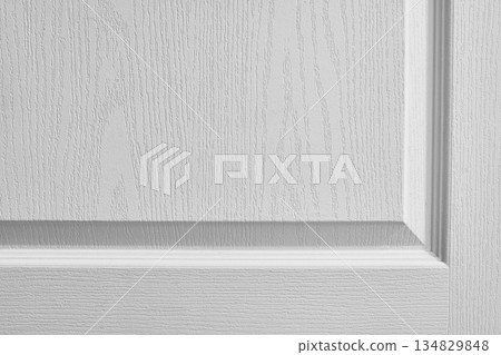 White textured wall with decorative molding, subtle relief pattern and soft natural shadow creating clean architectural background. Copy space White textured wall with decorative molding, subtle relief pattern and soft natural shadow creating clean architectural background. Copy space 134829848