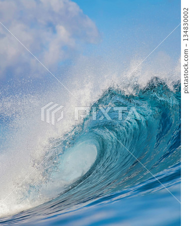 Majestic ocean swell with shimmering sunlight and foamy crest 134830002