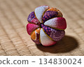 Purple and pink temari balls placed on tatami mats | Traditional Japanese crafts and Japanese-style background 134830024