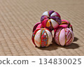 Multiple Temari balls lined up on a tatami mat | Traditional Japanese accessories and Japanese-style background image 134830025