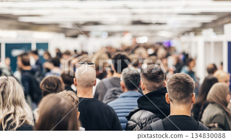 Abstract blurred people at exhibition hall of expo event trade show. Business convention show or job fair. Business concept background. Abstract blurred people at exhibition hall of expo event trade show. Business convention show or job fair. Business concept background. 134830088