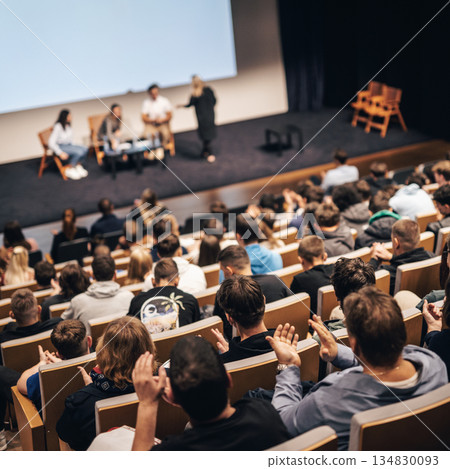Interview and round table discussion at business convention and presentation. Audience at the conference hall. Business and entrepreneurship symposium. 134830093