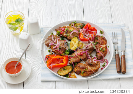 Grilled pork neck chunks with roasted veggies Grilled pork neck chunks with roasted veggies 134830284