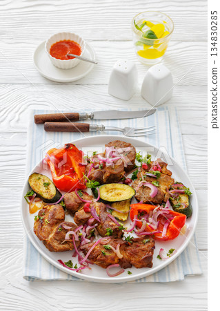 Grilled pork neck chunks with roasted veggies Grilled pork neck chunks with roasted veggies 134830285