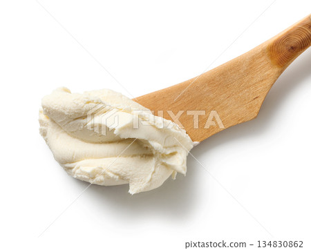fresh cream cheese on wooden knife fresh cream cheese on wooden knife 134830862