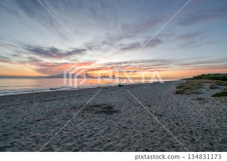 sunrise romantic couple on Corsican coast near Bastia Etang de Biguglia Camping San Daminao Beachside Corse 134831173