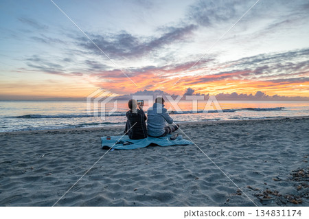 sunrise romantic couple on Corsican coast near Bastia Etang de Biguglia Camping San Daminao Beachside Corse 134831174