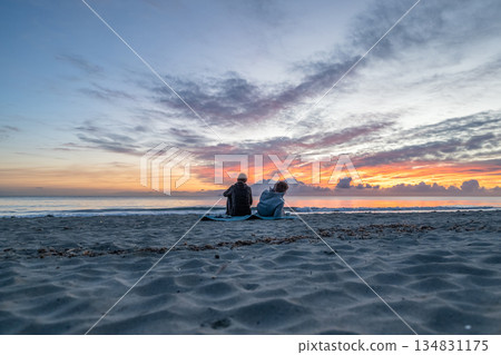 sunrise romantic couple on Corsican coast near Bastia Etang de Biguglia Camping San Daminao Beachside Corse 134831175