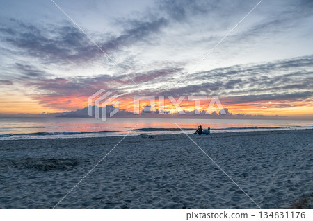 sunrise romantic couple on Corsican coast near Bastia Etang de Biguglia Camping San Daminao Beachside Corse 134831176