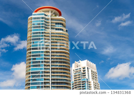 Miami South beach luxury apartment and blue sky. Miami skyscraper. Residential building in Miami, Florida. Apartment residential building building. Skyscraper architecture of Miami Miami South beach luxury apartment and blue sky. Miami skyscraper. Residential building in Miami, Florida. Apartment residential building building. Skyscraper architecture of Miami 134831368