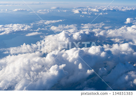 Aerial cloudy sky view. Cloud view from plane. Sky in cloud. Cloudscape with cloudy weather. Cloud and cloudscape aerial sky. Aerial cloudscape view covered with cloud. Dramatic cloudscape Aerial cloudy sky view. Cloud view from plane. Sky in cloud. Cloudscape with cloudy weather. Cloud and cloudscape aerial sky. Aerial cloudscape view covered with cloud. Dramatic cloudscape 134831383