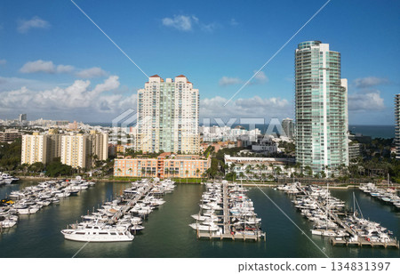 Yachting marina. Luxury yacht charter. Miami port marina. Luxury yachting in summer. Docked yacht in port of Miami. Marina luxury cityscape. Port with yacht. Fishing boats in marina Yachting marina. Luxury yacht charter. Miami port marina. Luxury yachting in summer. Docked yacht in port of Miami. Marina luxury cityscape. Port with yacht. Fishing boats in marina 134831397
