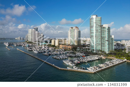 Docked yacht in port of Miami. Marina luxury cityscape. Port with yacht. Yachting marina. Luxury yacht charter. Miami port marina. Luxury yachting in summer. Charming marina 134831399