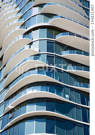 Architectural design. Building exterior architecture. Building background. Glass building design. Architectural detail. Background of architecture. Modern glass background. Glass exterior background Architectural design. Building exterior architecture. Building background. Glass building design. Architectural detail. Background of architecture. Modern glass background. Glass exterior background 134831407