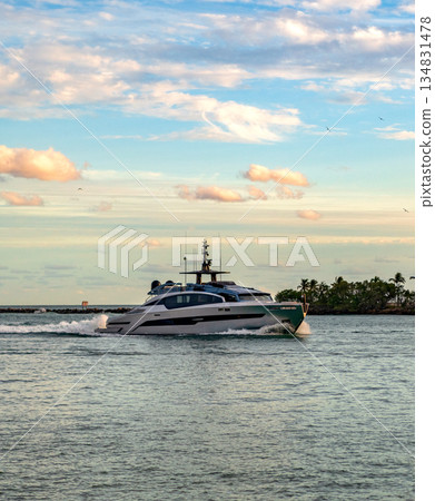 Luxury boat motor yacht at sea. Yachting boat tourism. Luxury lifestyle. Vacation on summer. Yacht at sea. Motorboat yacht sailing at sea. Motorboat in sunset Luxury boat motor yacht at sea. Yachting boat tourism. Luxury lifestyle. Vacation on summer. Yacht at sea. Motorboat yacht sailing at sea. Motorboat in sunset 134831478