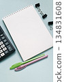 Notebook with calculator and pens on a blue background 134831608