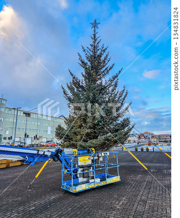 Installing Christmas Tree in City Square Using Aerial Lift 134831824