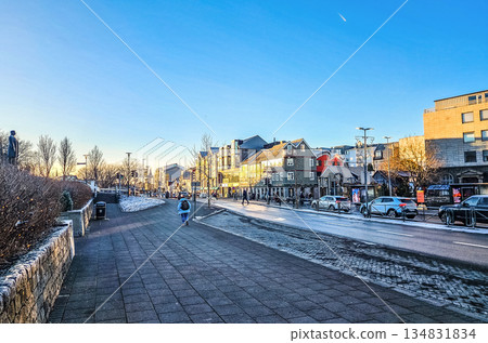 Winter City Street at Golden Hour with Pedestrians and Urban Traffic Winter City Street at Golden Hour with Pedestrians and Urban Traffic 134831834