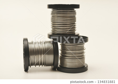 Coils with solder. Plastic coils with tin-lead solder. Materials for electronics repair. 134831881