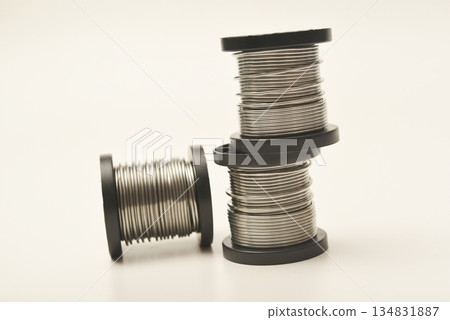 Coils with solder. Plastic coils with tin-lead solder. Materials for electronics repair. 134831887