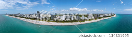 Aerial panorama of Miami Beach coastline. Stunning Miami skyline panorama. Drone panoramic view of Miamis view. Downtown Miami waterfront cityscape. South Beach panorama. Aerial panorama of Miami Beach coastline. Stunning Miami skyline panorama. Drone panoramic view of Miamis view. Downtown Miami waterfront cityscape. South Beach panorama. 134831995