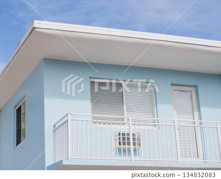 Apartment building with exterior detail. View of building facade. Residential building architecture. Architectural exterior. House exterior fragment. Modern apartment building facade Apartment building with exterior detail. View of building facade. Residential building architecture. Architectural exterior. House exterior fragment. Modern apartment building facade 134832083