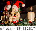 Wooden Sleigh with Santa Figurines and Ornaments in Festive Christmas Scene 134832317
