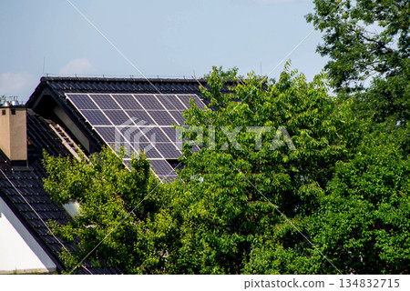 House roof with photovoltaic modules. Historic farm house with modern solar panels on roof and wall High quality photo House roof with photovoltaic modules. Historic farm house with modern solar panels on roof and wall High quality photo 134832715