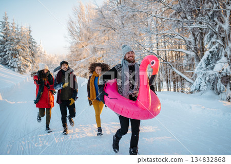 Group of friends enjoying winter time in snowy nature. 134832868