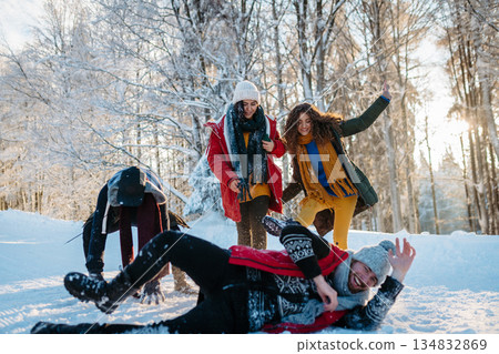 Group of friends enjoying winter time in snowy nature. 134832869