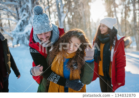 Group of friends enjoying winter time in snowy nature. 134832870