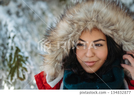 Woman enjoying winter time in snowy nature. 134832877