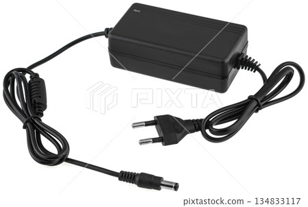 Compact power adapter for household appliances with a European plug and round connector. 134833117