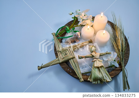 Imbolc altar with brigid cross and doll, celebrating spring Imbolc altar with brigid cross and doll, celebrating spring 134833275