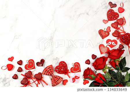 Greeting card with roses, hearts and gift boxes on light background.Concept for Valentine's Day or Women's Day, Mother's Day, banner, happy holiday, birthday greetings, selective focus 134833649