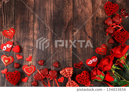Greeting card with roses, hearts and gift boxes on wooden background.Concept for Valentine's Day or Women's Day, Mother's Day, banner, happy holiday, birthday greetings, selective focus 134833656