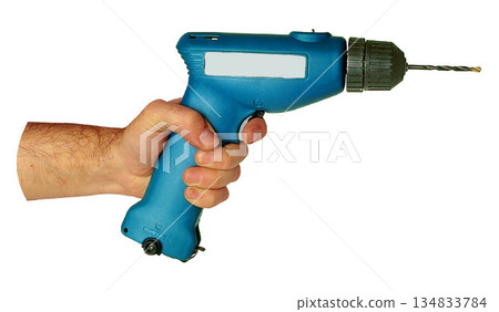 Blue Cordless Drill in Hand with a metallic drill bit isolated on white background Blue Cordless Drill in Hand with a metallic drill bit isolated on white background 134833784