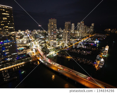 Night view. Yacht club. Marina in night. Summer vacation. Downtown city marina with luxury illuminated yacht. Docked vessels. Luxury yacht in night marina. Luxury yacht at night 134834298