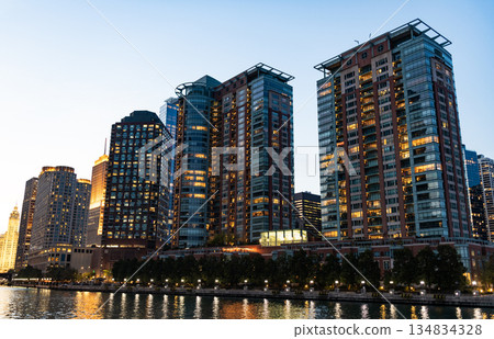 Architectural Chicago city downtown. Skyscraper architecture. City cityscape. Cityscape with building. Downtown architecture and river. Illuminated city. Chicago River cruises in City 134834328